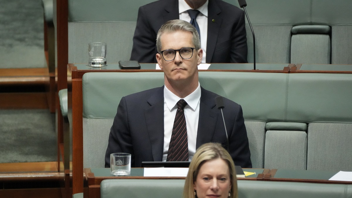 Assistant Minister Andrew Charlton seated in Australia's House of Representatives