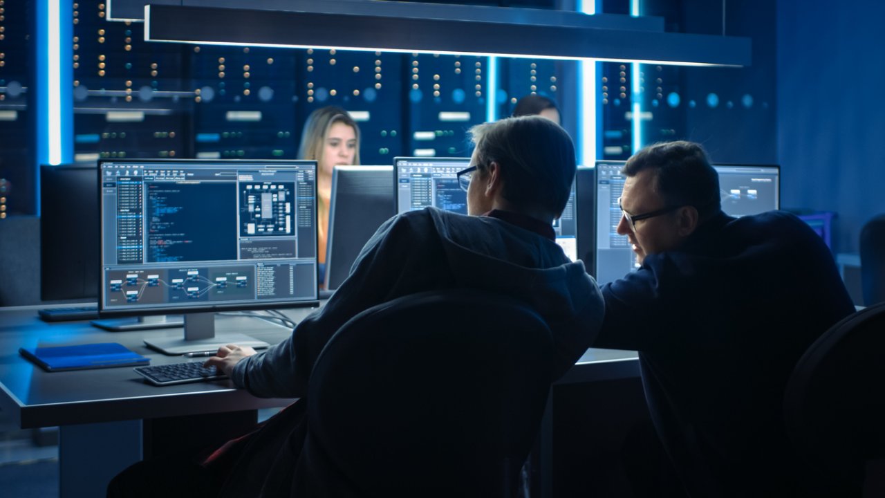 Data center control room with operators at monitors and server racks visible behind glass, from EPA Clean Air Act Resources for Data Centers page