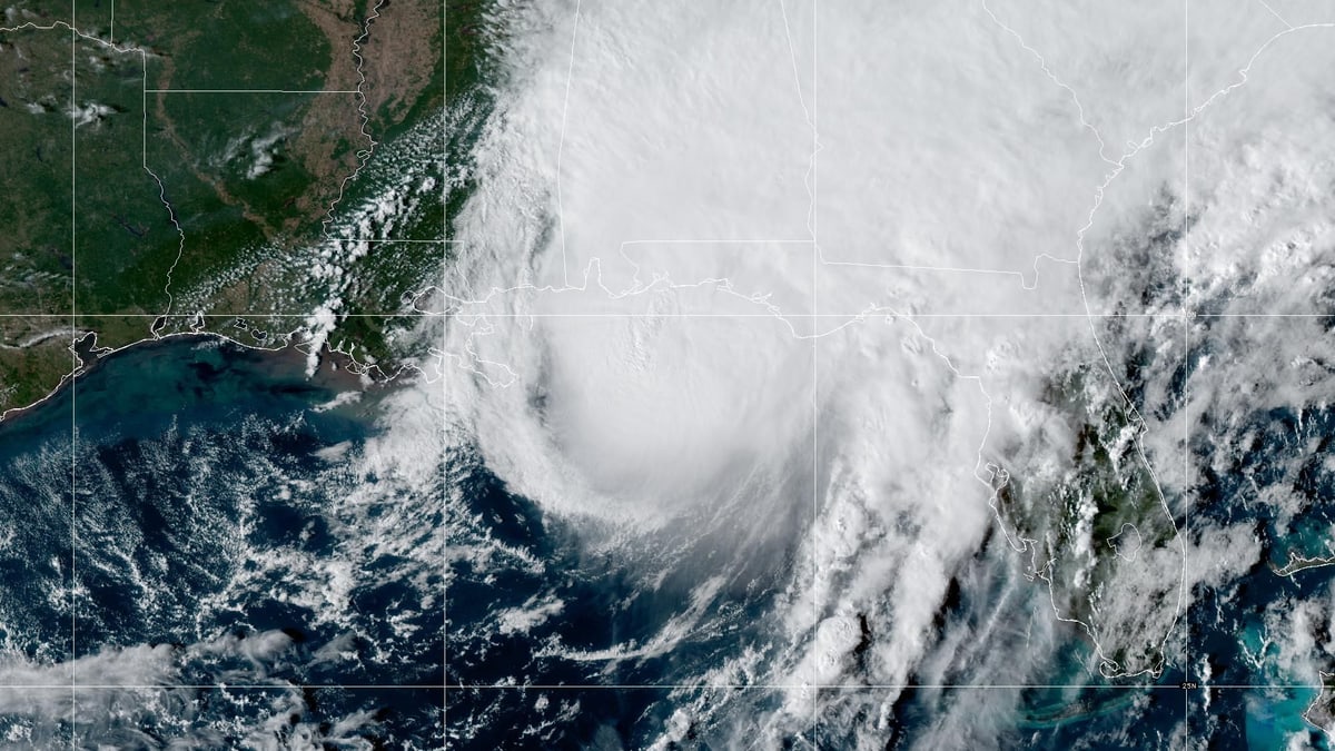 Satellite view of Hurricane Isaias, a large white swirl of cloud over the northern Gulf, nearing the Florida Panhandle and Alabama coast