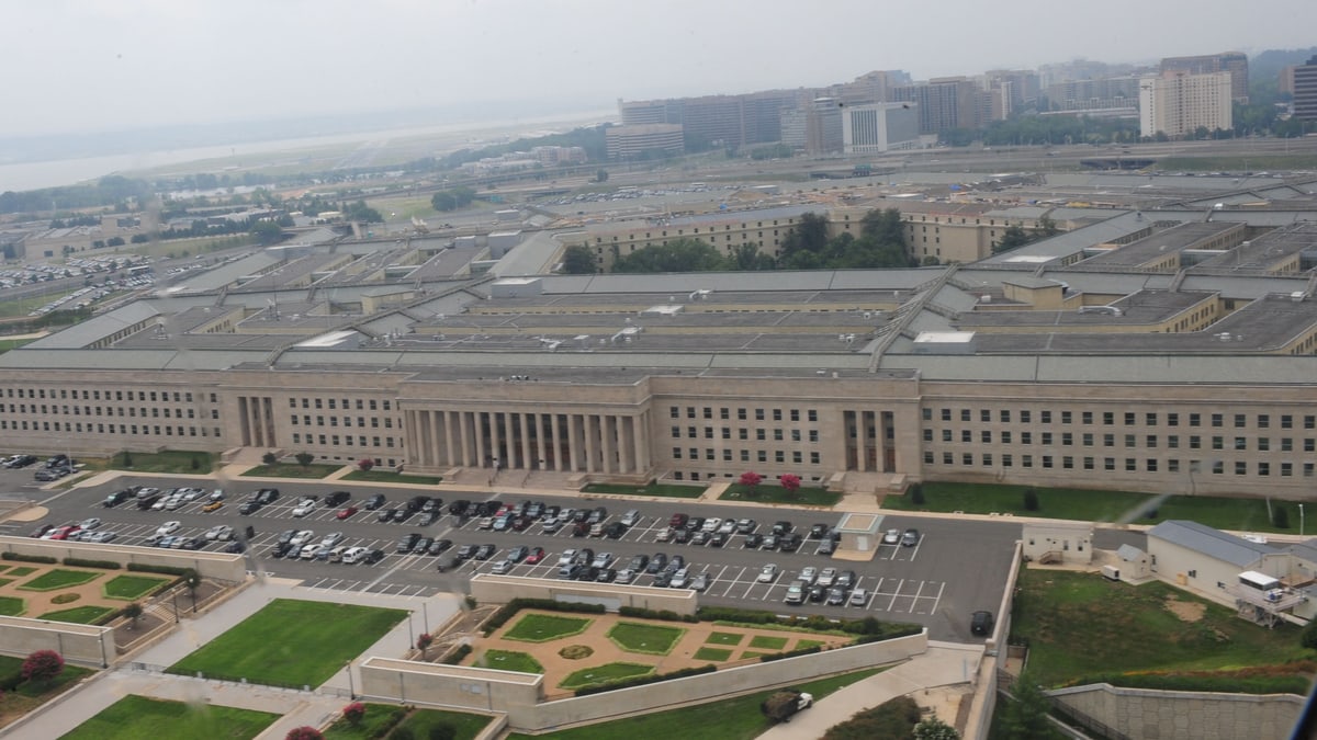 Aerial view of the Pentagon, the Defense Department's headquarters in Arlington, Virginia, with its parking lot and the city beyond