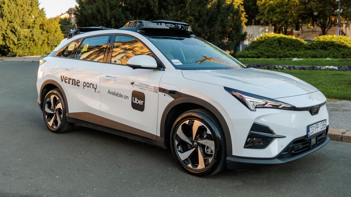 A white Pony.ai self-driving car with sensors on its roof and Verne, Pony.ai and "Available on Uber" markings on its doors, in Zagreb, Croatia