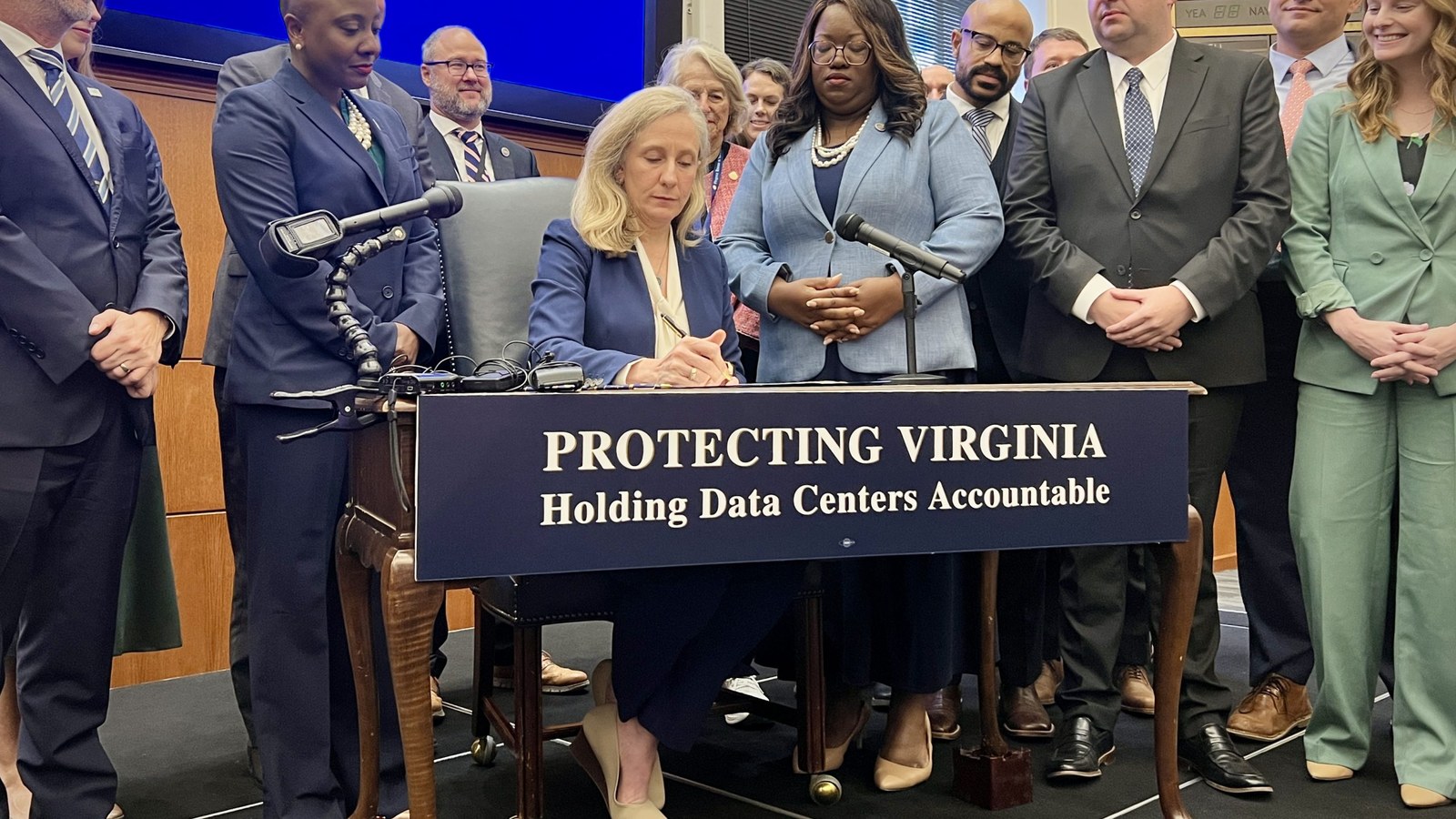 Gov. Abigail Spanberger signing Executive Order 22 on data-center accountability at a Sept. 18, 2026, Virginia press event