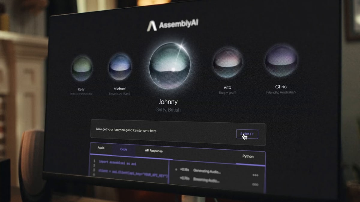 A computer screen on a home desk shows AssemblyAI's row of voice choices, with a gritty British voice named Johnny picked and a line for the voice to say typed below