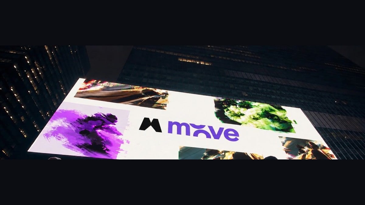 Magnific's launch video: a huge screen on a tall building at night, showing the Move name and colorful animated images