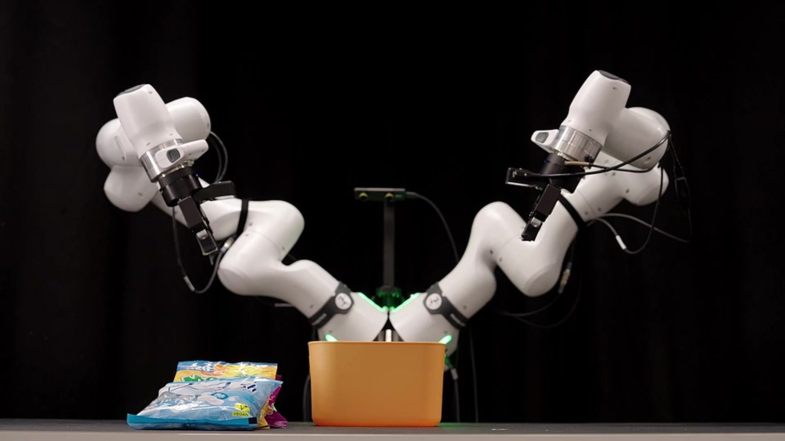 Odyssey-3 robot-arm demonstration still from the official launch page: physical agent control on a foundation world model