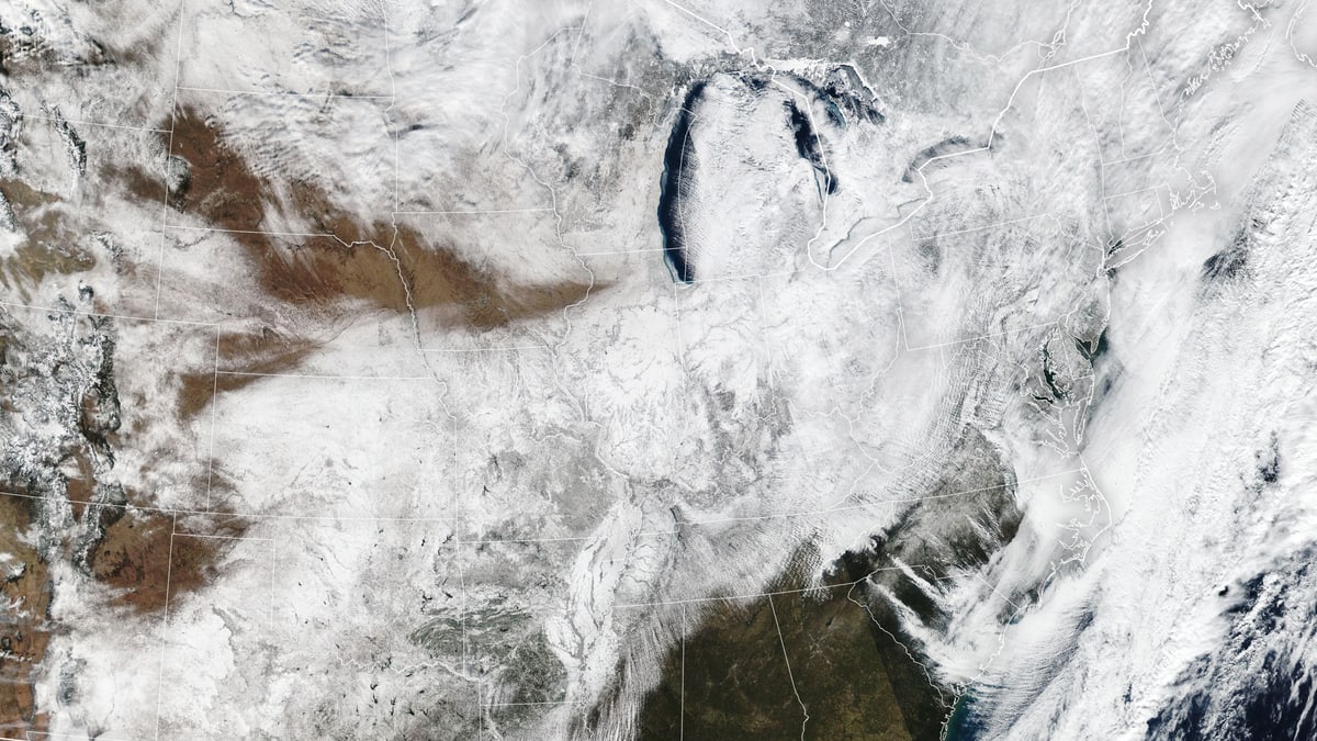 NASA satellite image of fresh snow covering much of the central and eastern United States on Jan. 26, 2026, after a major winter storm