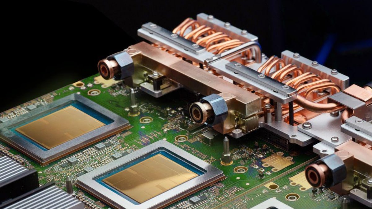 A Google TPU board, with two gold chips and copper liquid-cooling pipes, from Google's announcement of TPUs on Oracle's cloud